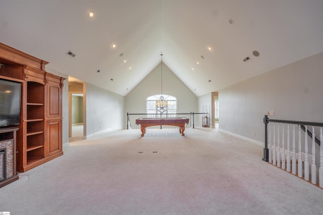 game room featuring high vaulted ceiling, a stone fireplace, billiards, a notable chandelier, and light colored carpet