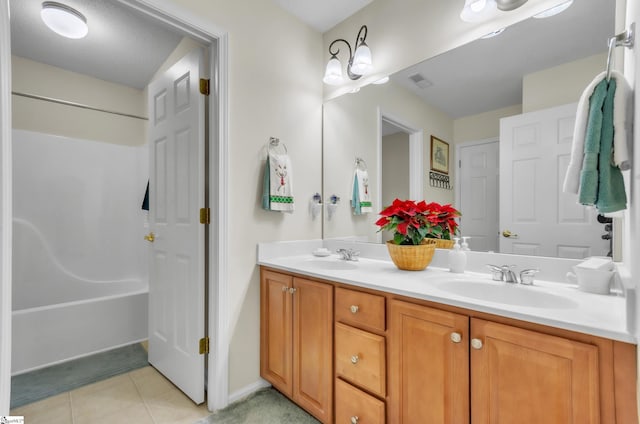 bathroom with vanity and tile patterned floors