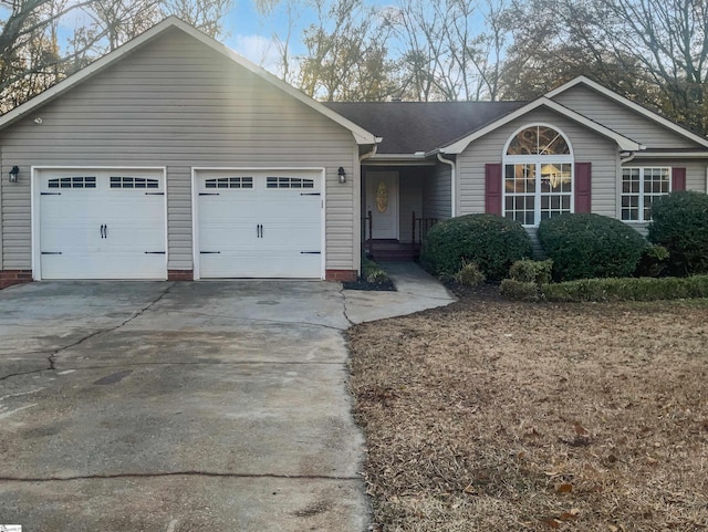 single story home featuring a garage