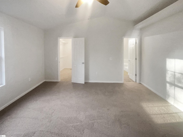 spare room with carpet flooring, ceiling fan, and lofted ceiling