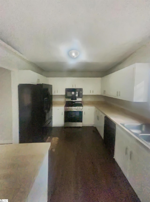 kitchen featuring white cabinets and black appliances