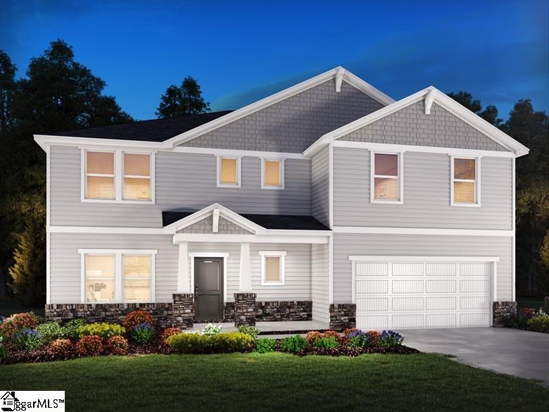 view of front of house with driveway, stone siding, an attached garage, and a front yard