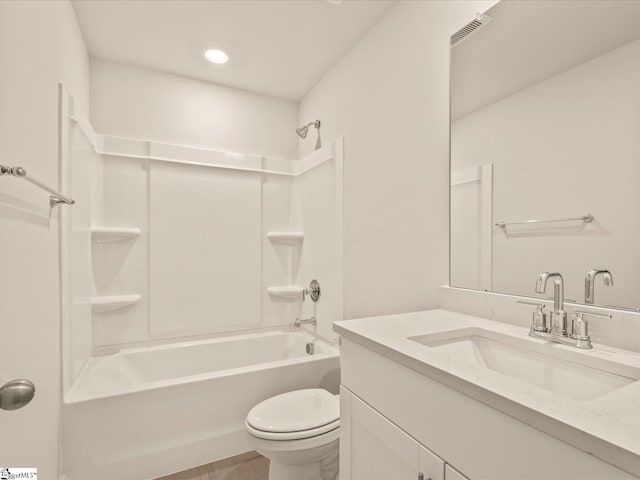 full bathroom featuring toilet, vanity, and bathing tub / shower combination