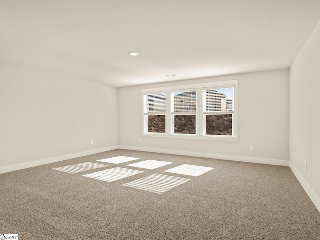 unfurnished room featuring carpet floors