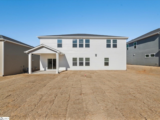 back of property featuring a patio