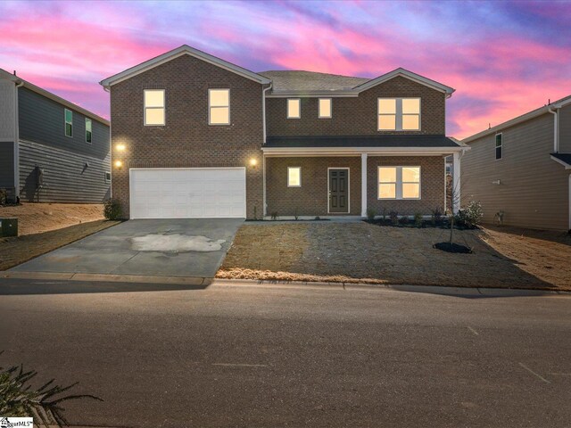 view of front of property with a garage