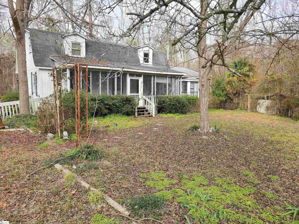 view of front facade featuring a sunroom