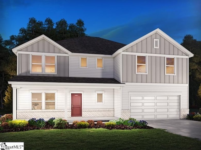 view of front facade featuring a front yard and a garage