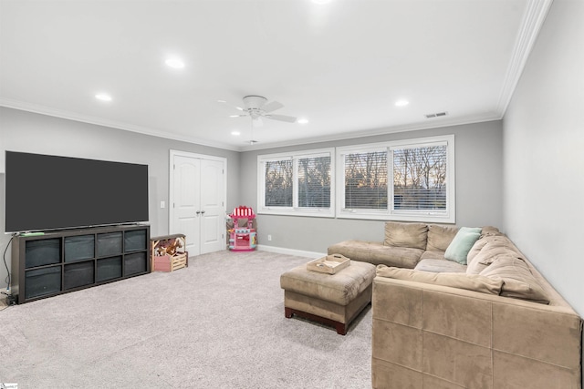 carpeted living room featuring ceiling fan and ornamental molding