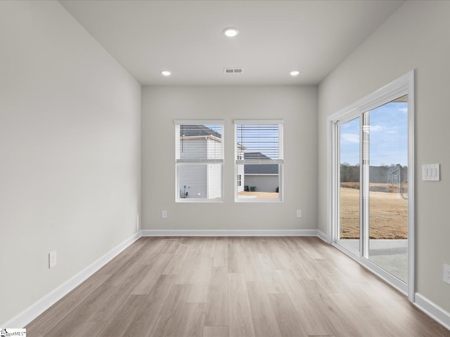 empty room featuring light hardwood / wood-style floors