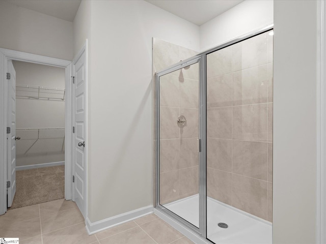 bathroom featuring tile patterned flooring and walk in shower