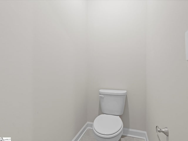 bathroom featuring tile patterned floors and toilet