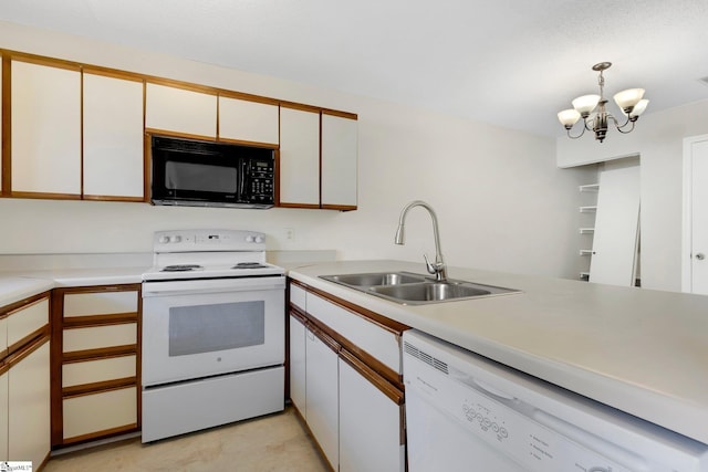 kitchen featuring white cabinets, white appliances, sink, pendant lighting, and a chandelier