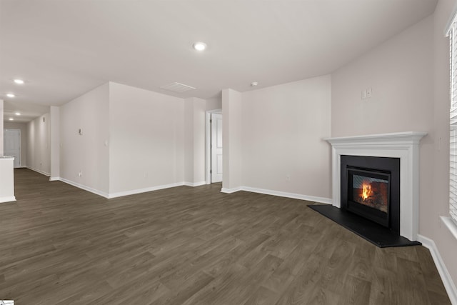 unfurnished living room featuring dark hardwood / wood-style flooring