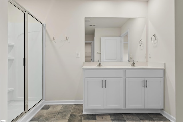 bathroom featuring vanity and walk in shower