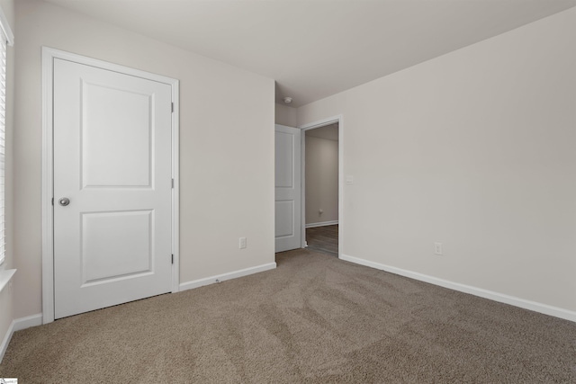 unfurnished bedroom featuring carpet flooring