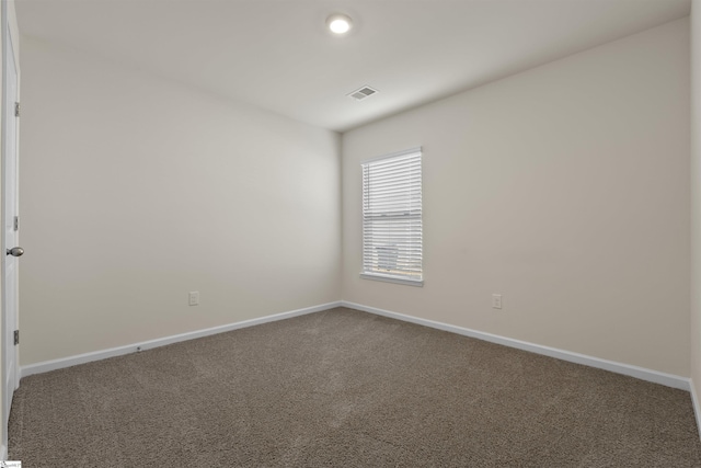 spare room featuring carpet