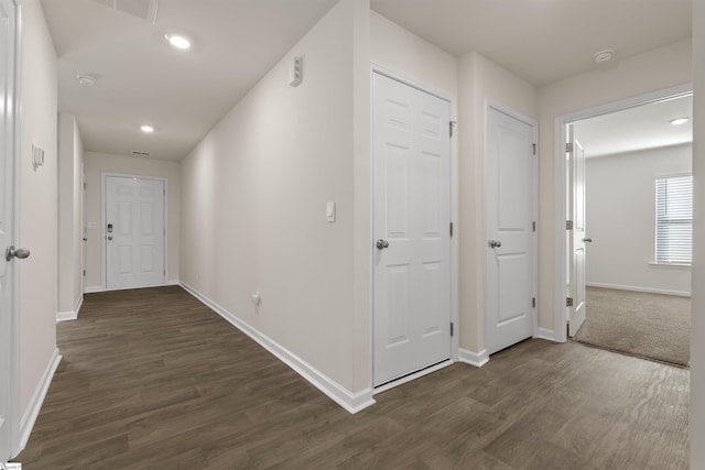 corridor featuring dark wood-type flooring