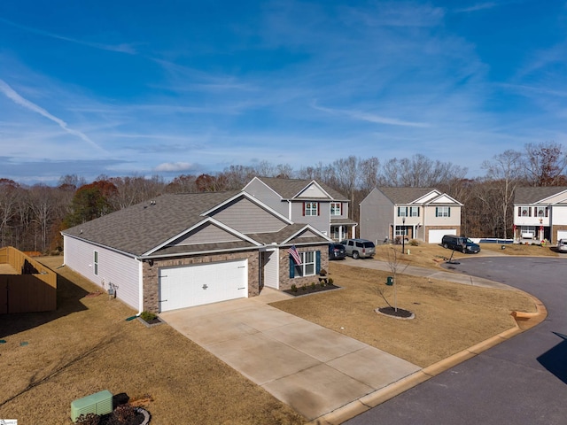 view of front of home featuring a front yard and a garage