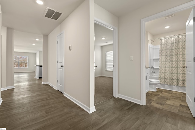 hall featuring dark wood-type flooring