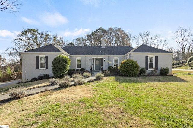 single story home with a front lawn