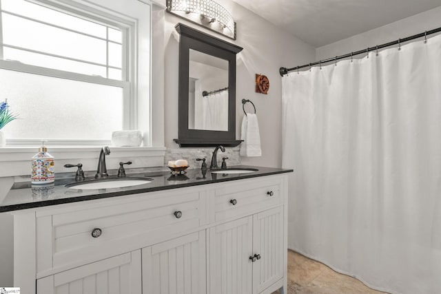 bathroom with tile patterned flooring and vanity