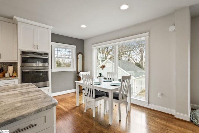 dining area featuring wood-type flooring