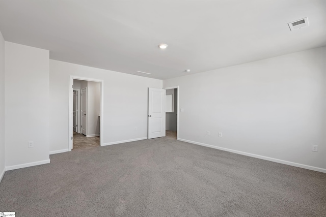 unfurnished bedroom with visible vents, baseboards, and carpet