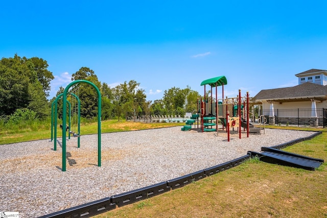 community playground with a lawn and fence