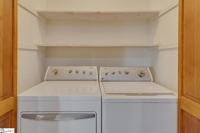 laundry room featuring washing machine and clothes dryer