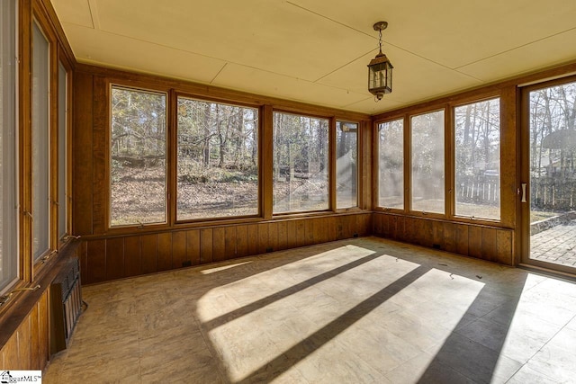 unfurnished sunroom featuring plenty of natural light