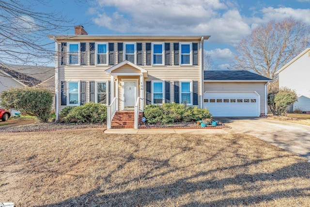 colonial home with a garage