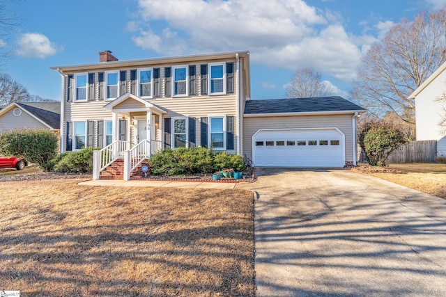 colonial inspired home featuring a garage