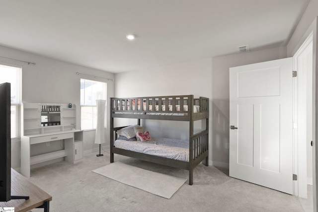 bedroom with light colored carpet