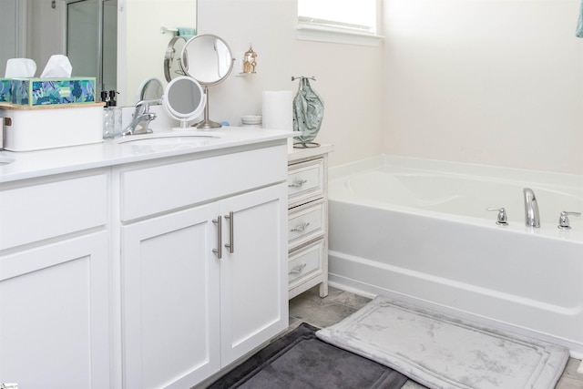 bathroom featuring vanity and a bathtub