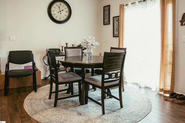 dining area with dark wood-type flooring