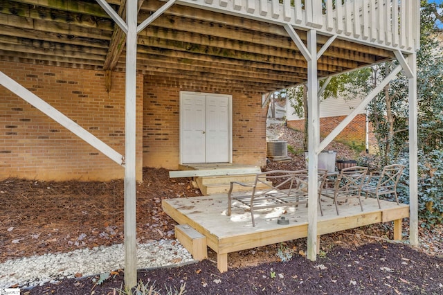 wooden deck featuring central air condition unit