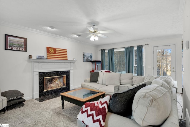 living room featuring a high end fireplace, carpet, and ornamental molding