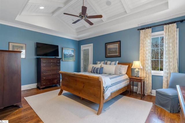 bedroom with ornamental molding, lofted ceiling with beams, ceiling fan, and dark wood-type flooring