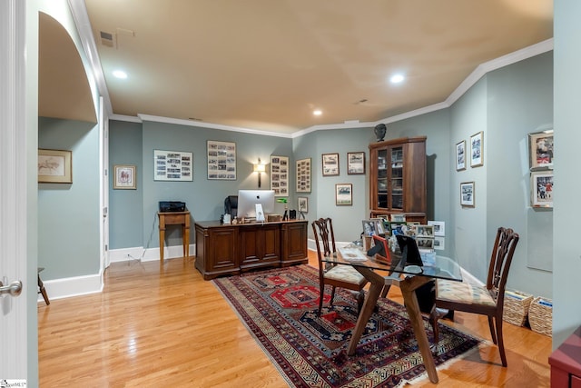 office area featuring light hardwood / wood-style flooring and ornamental molding