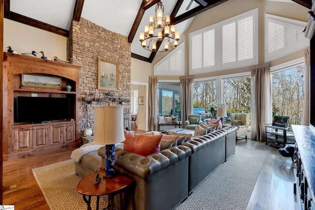 living room featuring beam ceiling, light hardwood / wood-style flooring, high vaulted ceiling, and a notable chandelier