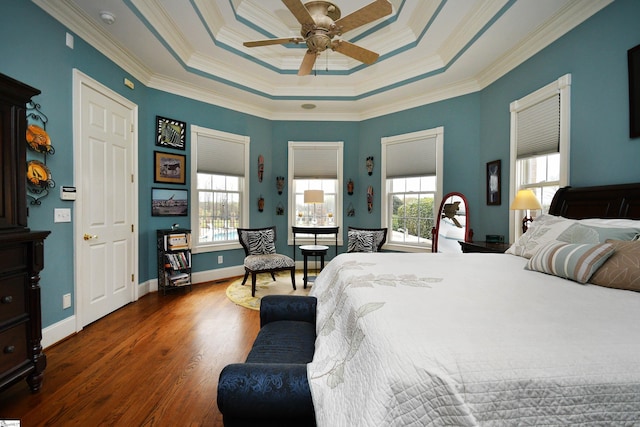 bedroom with ceiling fan, dark hardwood / wood-style flooring, crown molding, and multiple windows