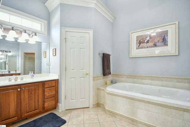 bathroom featuring vanity, a relaxing tiled tub, and tile patterned floors