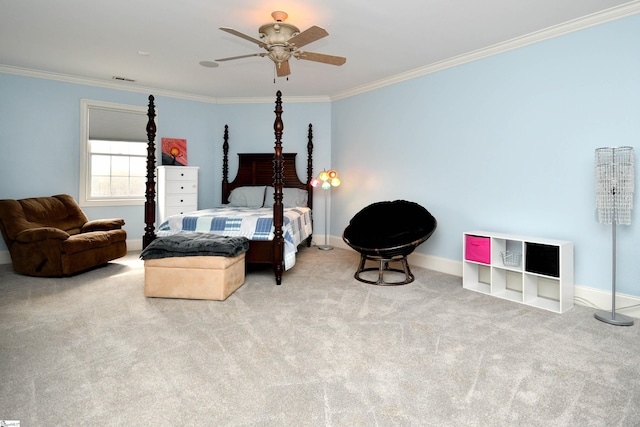 carpeted bedroom with ceiling fan and ornamental molding