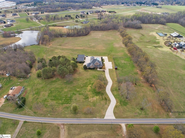 drone / aerial view featuring a rural view and a water view