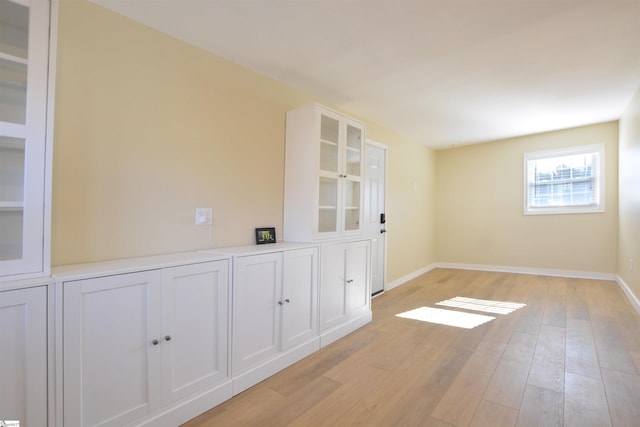 unfurnished room with light hardwood / wood-style flooring