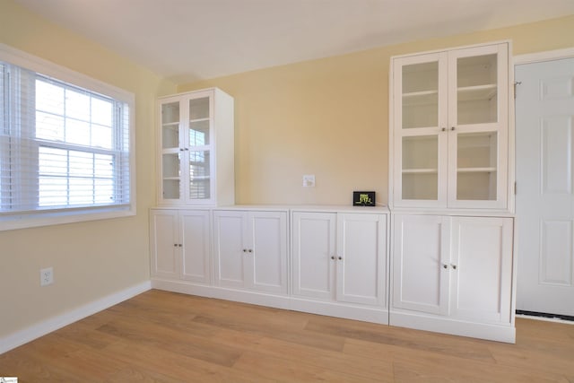 empty room with light hardwood / wood-style floors