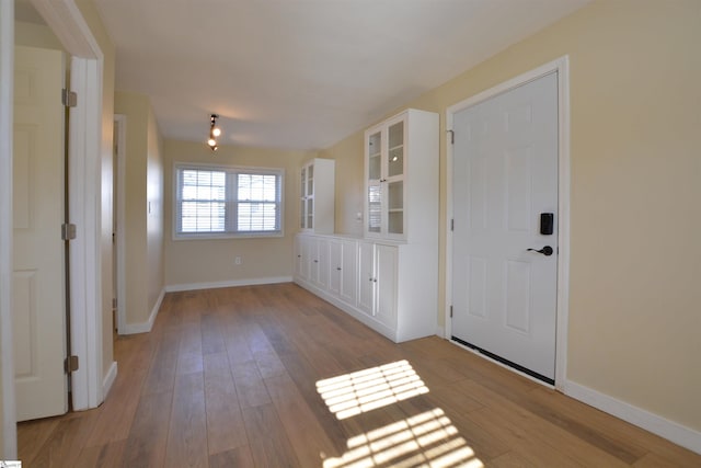 entryway with light hardwood / wood-style flooring