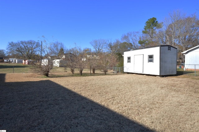 view of yard with a storage unit