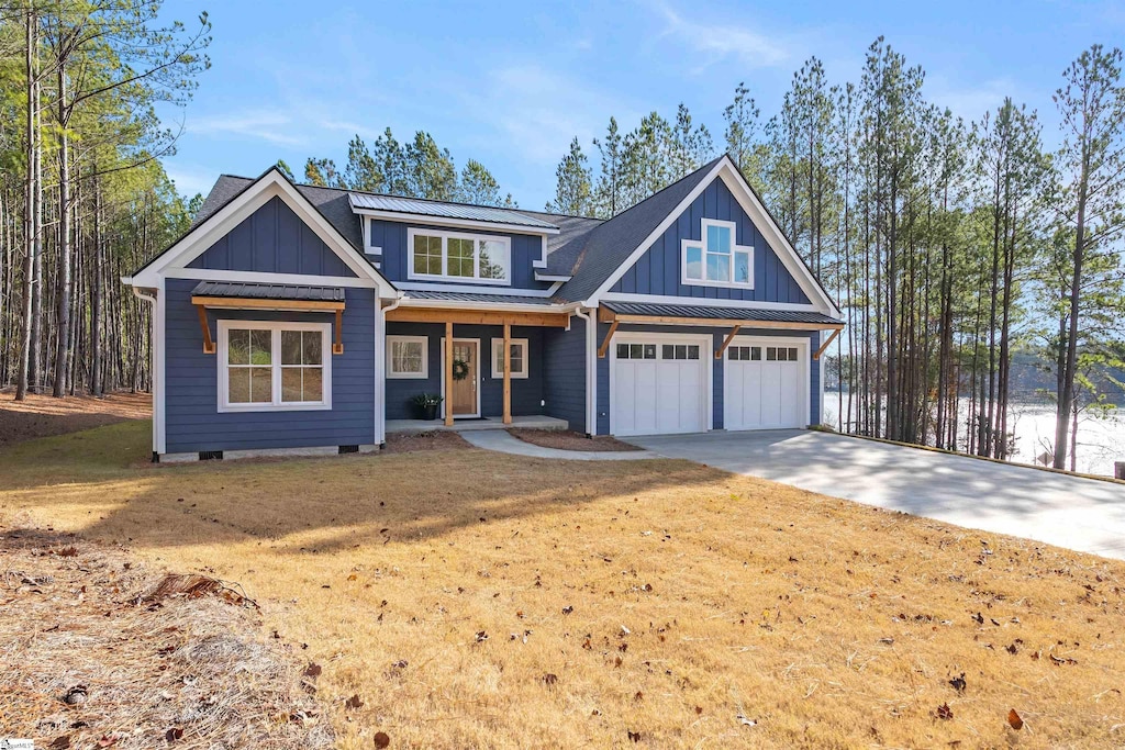 craftsman-style home with a front yard and a garage